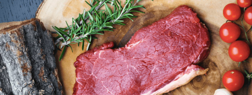 Raw beef meat on a chopping board